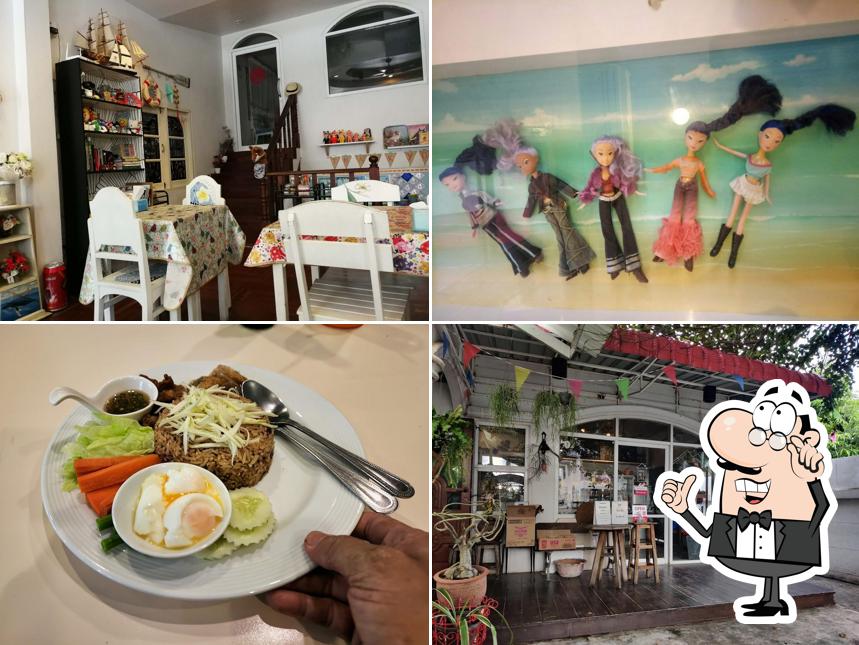 Take a seat at one of the tables at ร้านอาหาร บ้านเลขที่ 13