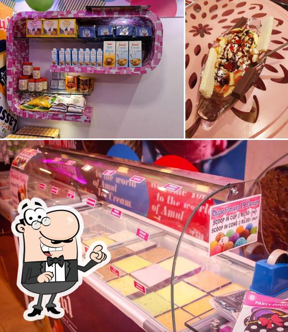 Check out the image displaying interior and food at Temptation Centre