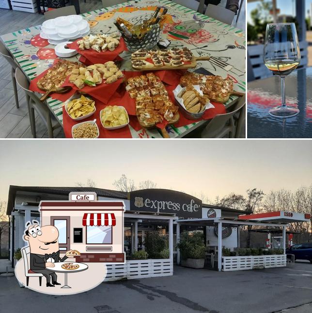 La immagine di esterno e tavolo da pranzo da Express Cafè