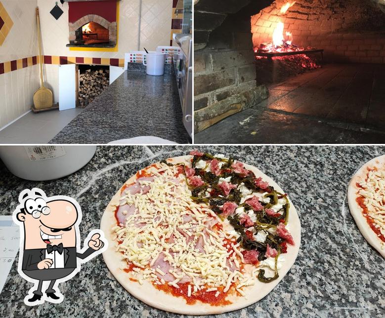 La foto di interni e pizza da Pizzeria Quadrifoglio