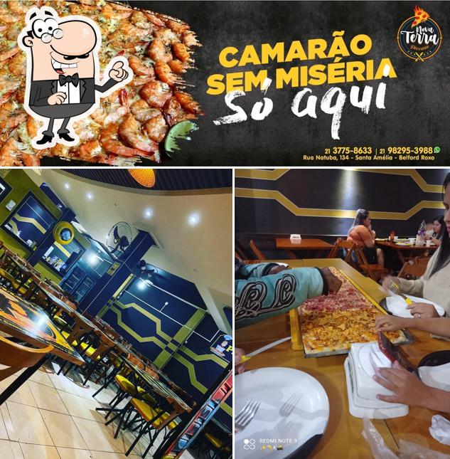 Entre diferentes coisas, interior e frutos do mar podem ser encontrados a Nova Terra Pizzaria