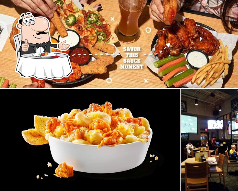 Check out the image showing dining table and food at Buffalo Wild Wings