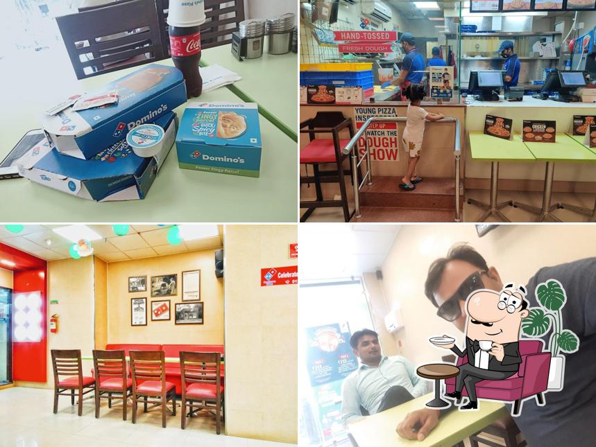 Take a seat at one of the tables at Domino's Pizza Arjun Nagar, Hapur