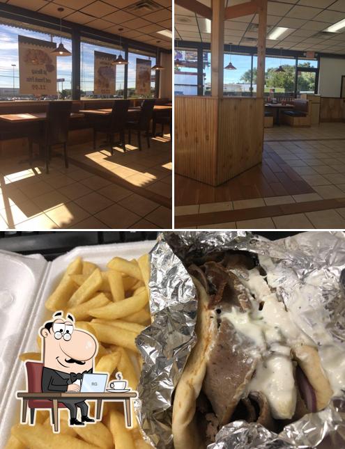 The photo of interior and food at ANF Gyros & Grill