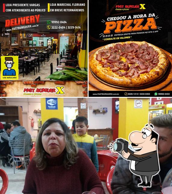 Look at the picture of Fast Burguer X e Pizza Centro
