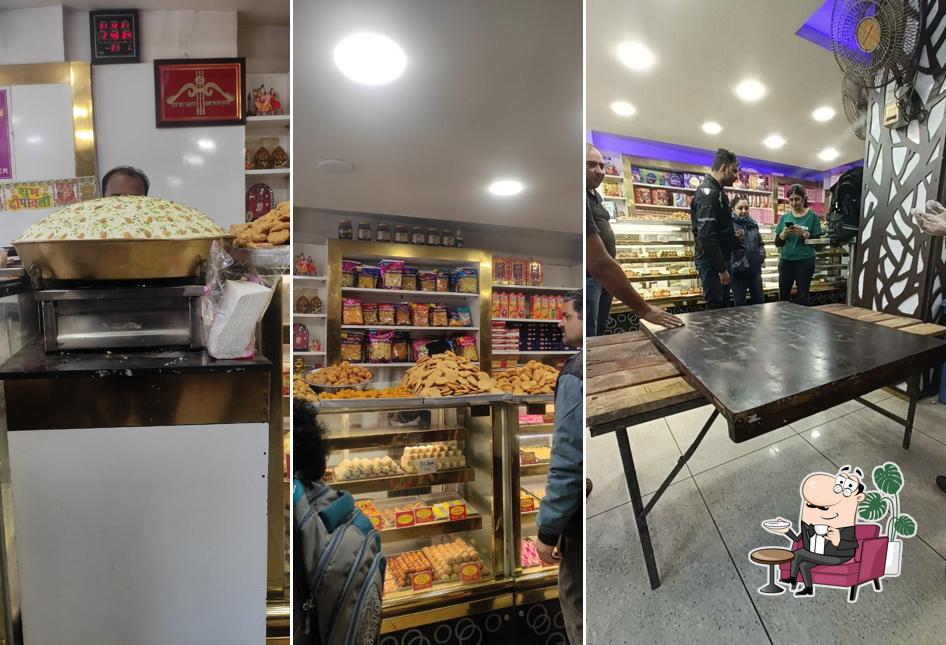 Take a seat at one of the tables at Gupta Sweets