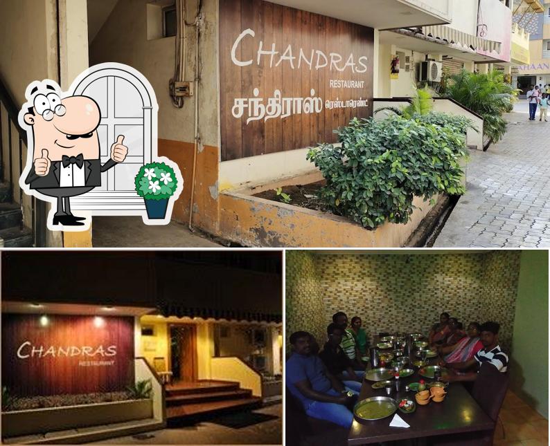 This is the image depicting exterior and dining table at Chandra's Restaurant - A/C