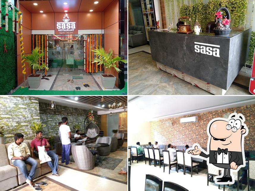 Take a seat at one of the tables at UPPADA SASA MULTI CUISINE RESTAURANT