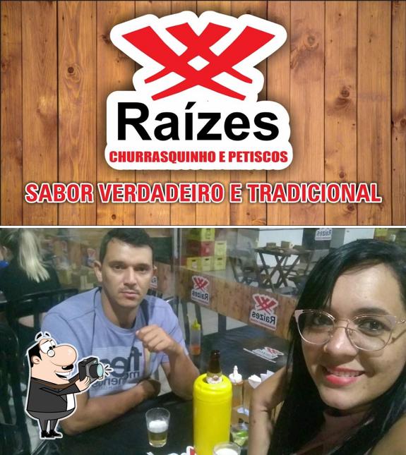 Look at the picture of Raízes Churrasquinho e Petiscos Bar