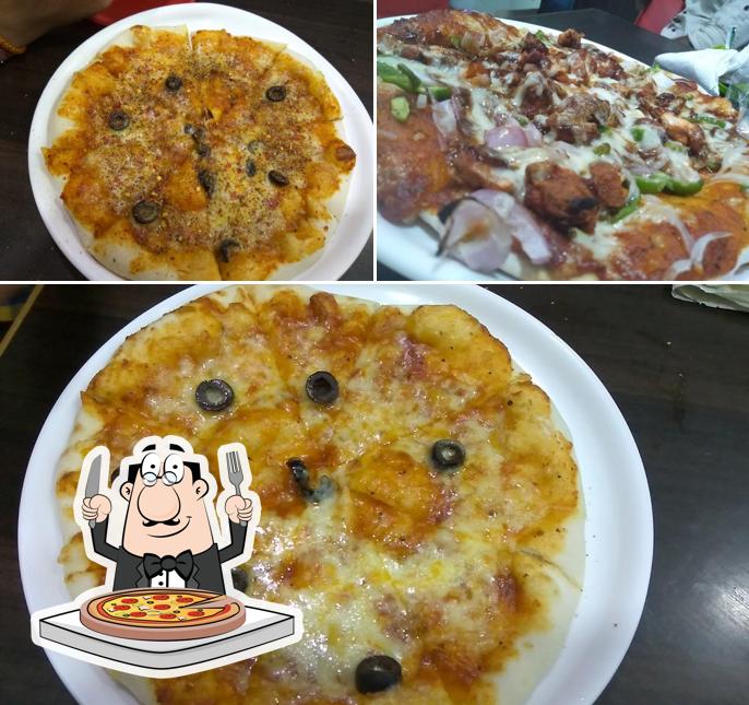 Try out pizza at NEW DOMENO Restaurant