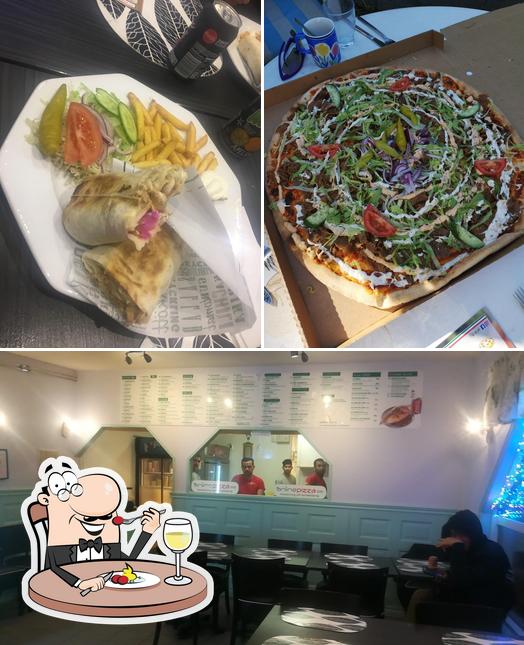 Фото, на котором видны еда и внутреннее оформление в Sunda Pizzeria