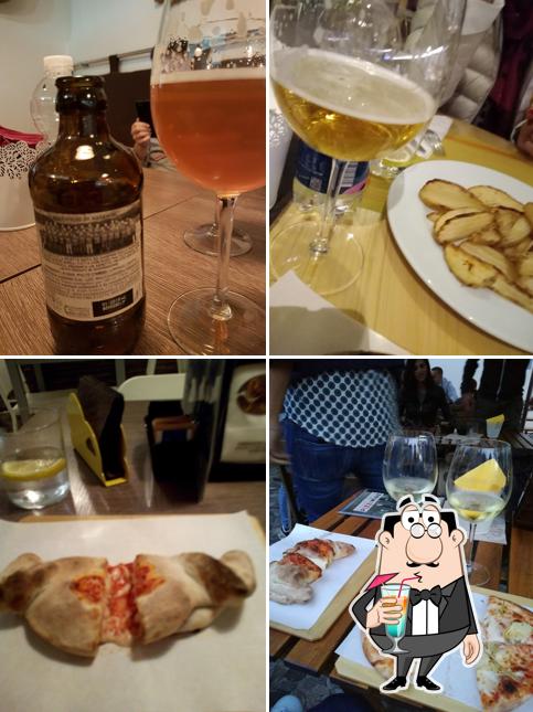 Questa è la foto che presenta la bevanda e tavolo da pranzo di PIZZIWINE