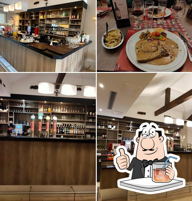 Parmi les différentes choses de la boire et la comptoir de bar, une personne peut trouver sur Restaurant Des Lys D'Alsace