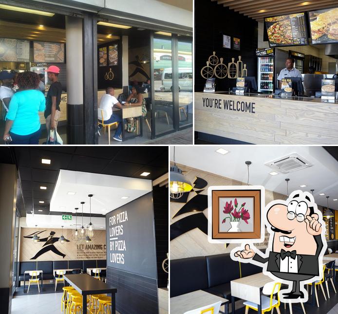 El interior de Debonairs Pizza