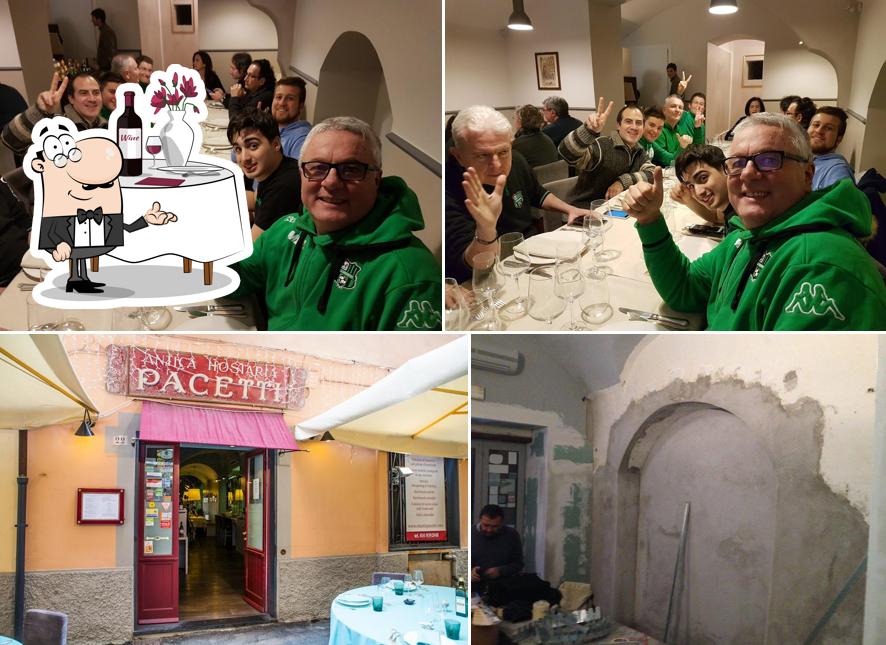 Questa è la foto che presenta la tavolo da pranzo e interni di Antica Hostaria Pacetti