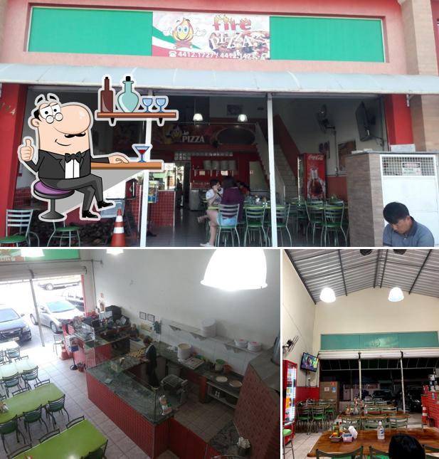 O interior do Pizzaria e Esfiharia Fire