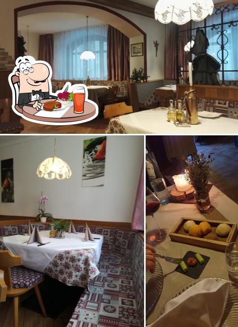 Guarda la foto che presenta la tavolo da pranzo e interni di Albergo Ristorante Pizzeria Sterzingerhof