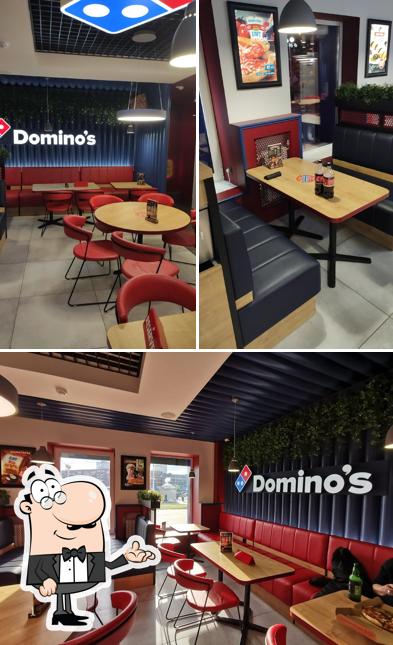 Посмотрите на внутренний интерьер "Domino's Pizza"