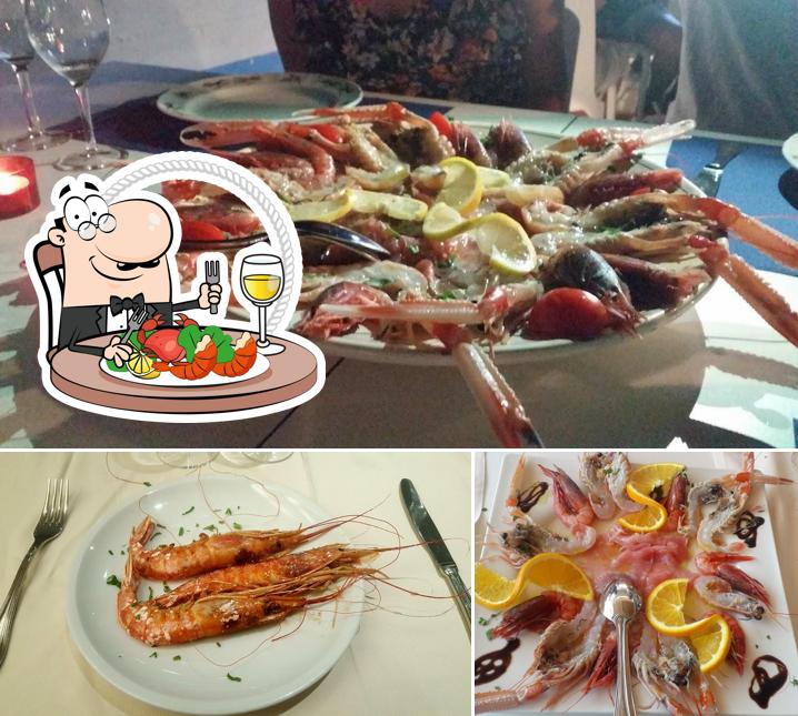 Prenez des fruits de mer à Hotel Ristorante L'Angolo di Beppe - ALBERGO NEL SALENTO a pochi metri dalla spiaggia libera di TORRE LAPILLO Porto Cesareo