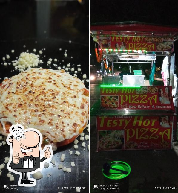 Look at the image of Testy Hot Pizza