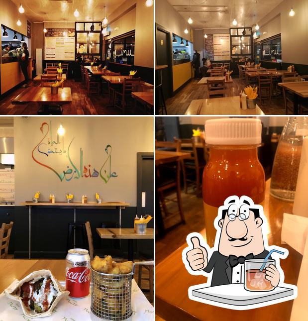 Take a look at the image showing drink and interior at Umi Falafel
