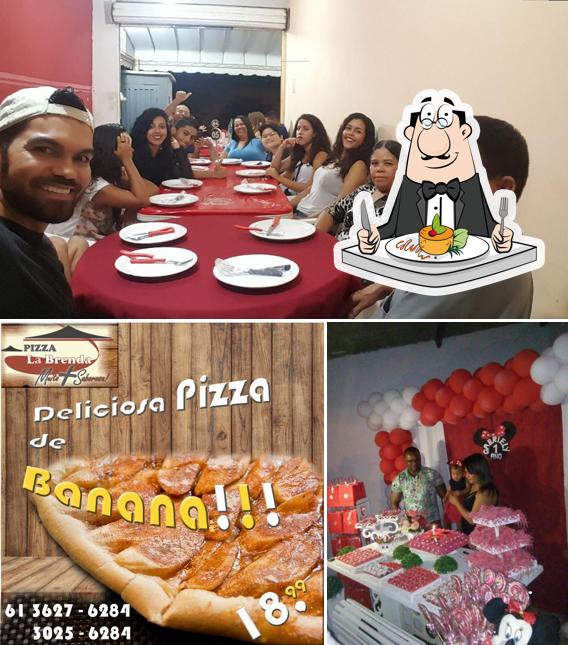 Check out the photo showing food and dining table at Pizza La Brenda