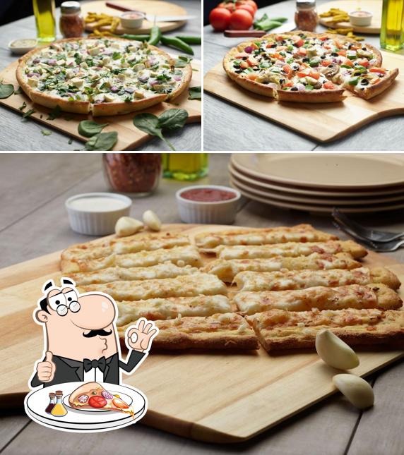 Prenez différents genres de pizzas