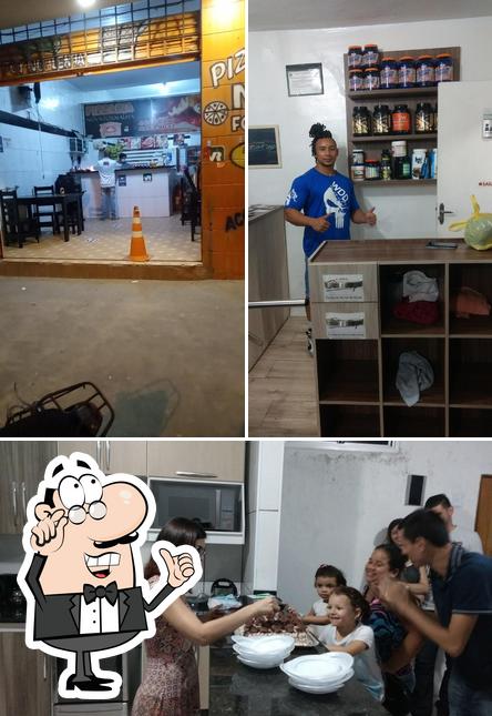 O interior do Pizzaria Nova Fornalha