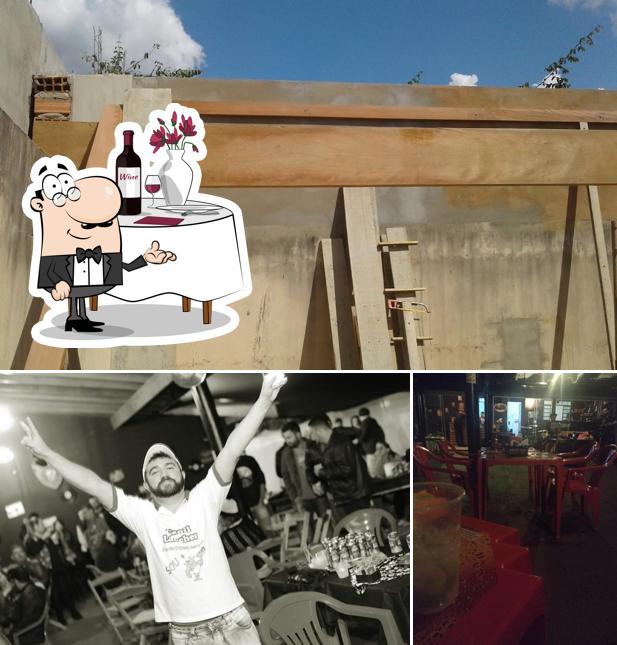 Esta é a foto apresentando mesa de jantar e exterior no Canil Lanches