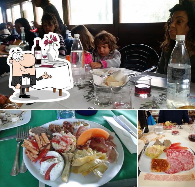 Questa è la foto che mostra la tavolo da pranzo e cibo di Ristorante La Colombaia