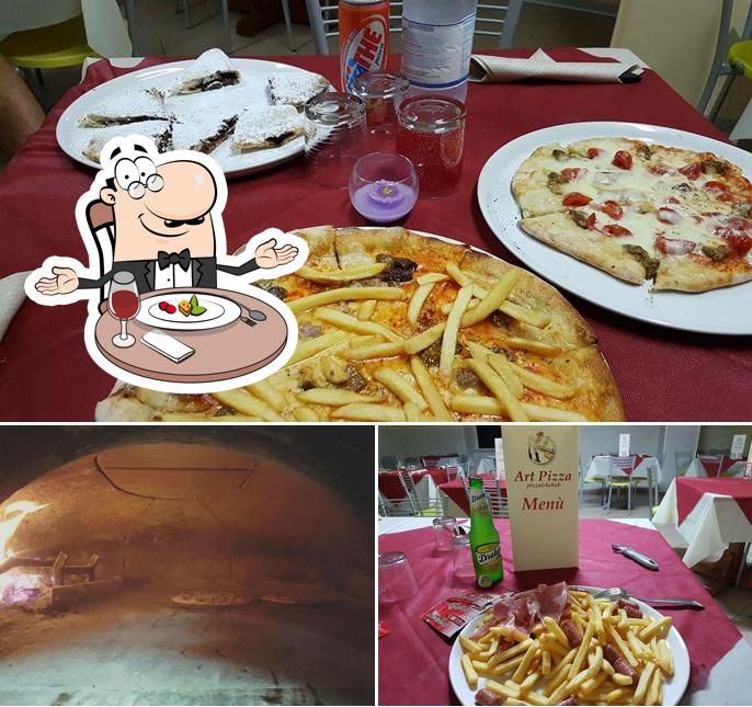 La immagine della tavolo da pranzo e esterno di Art Pizza