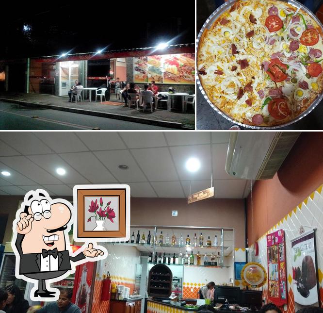 A imagem do Pizzaria Rio Sul’s interior e pizza