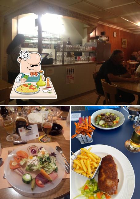 Dai un’occhiata alla foto che presenta la cibo e interni di Gasthaus Weingarten