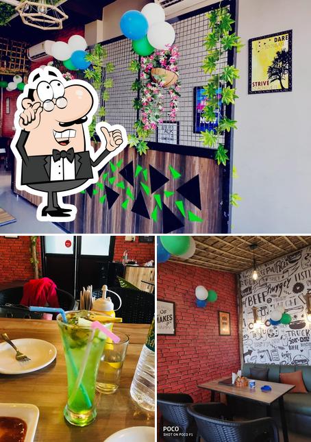 Take a look at the image displaying interior and alcohol at Green Leaf Cafe