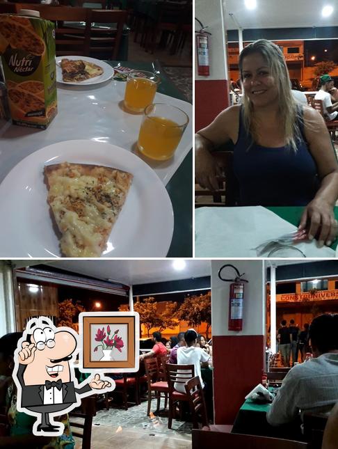 Esta é a foto mostrando interior e comida no Pizzaria Bella Pizza / São Sebastião