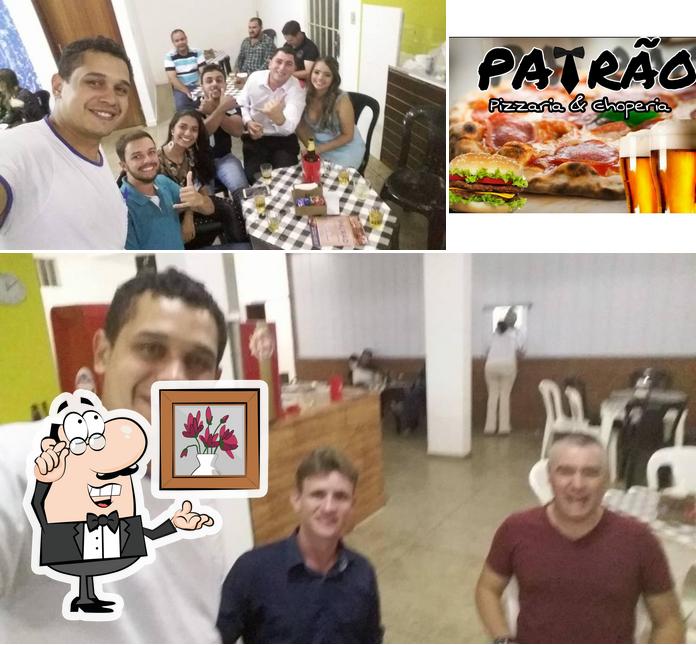 A foto a Patrão Pizzaria & Choperia’s interior e cidadãos