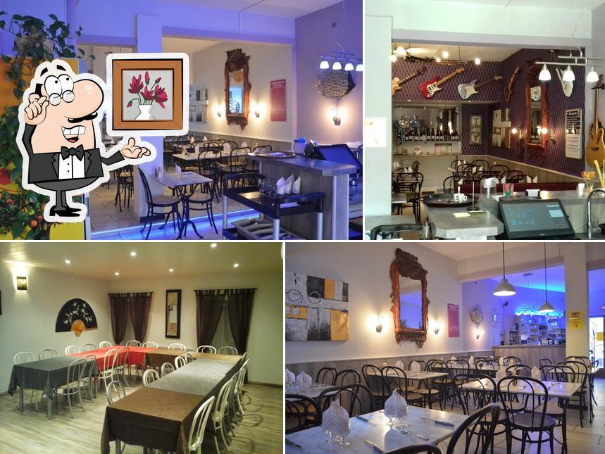 Installez-vous à l'une des tables de Restaurant Pizzéria La Cambuse