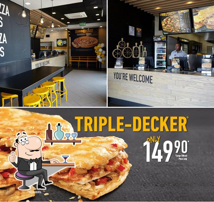 La photo de la intérieur et burger concernant Debonairs Pizza