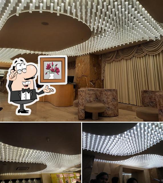 Take a seat at one of the tables at BONHOMIE 2 RESTAURANT & BANQUET, PALDI-BHATTA, AHMEDABAD