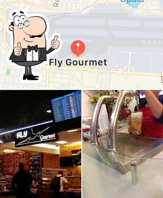 Look at the photo of Fly Café