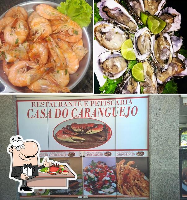 Попробуйте блюда с морепродуктами в "Caranguejo Restaurante e Petiscaria"
