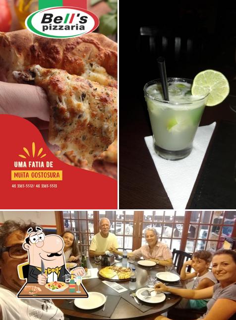 A foto a Bell’s Pizzaria’s comida e mesa de jantar