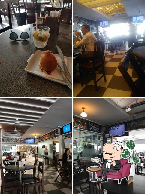 Sente em uma das mesas no Cia do Chopp