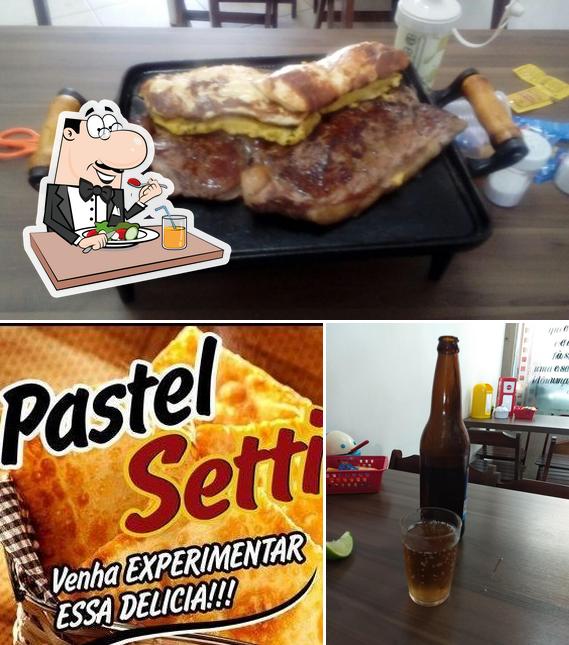 Esta é a foto apresentando comida e cerveja no Pastel Setti