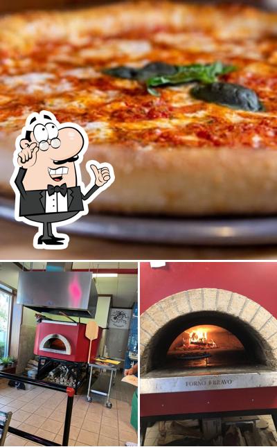 The picture of interior and pizza at Ignazio's Pizzeria Pizza Mystic CT