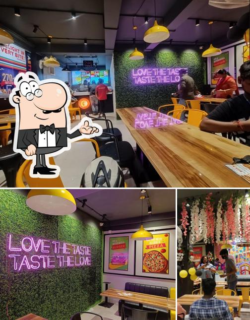 Among various things one can find interior and food at Grill Inn Godda