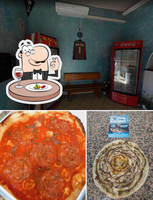 Qui Pizza si caratterizza per la cibo e interni