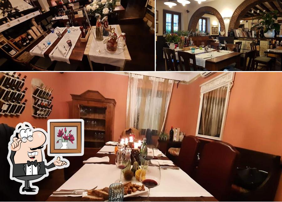 Dai un'occhiata agli interni di Hostaria Alla Tavernetta