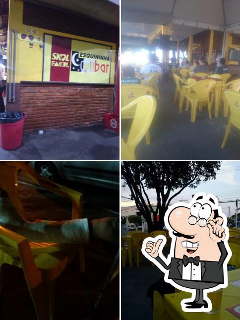 Sente em uma das mesas no Esquininha Bar e Restaurante
