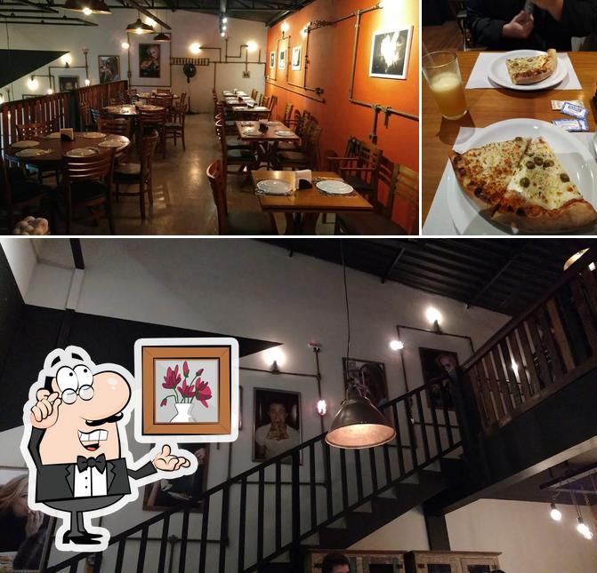 O Pizzaria Maximu’s se destaca pelo interior e mesa de jantar